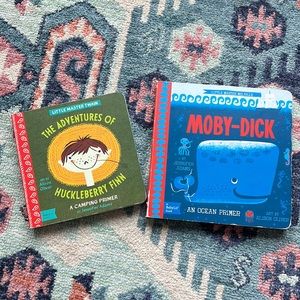 The Adventures of Huckleberry Finn board book and Moby Dick board book.